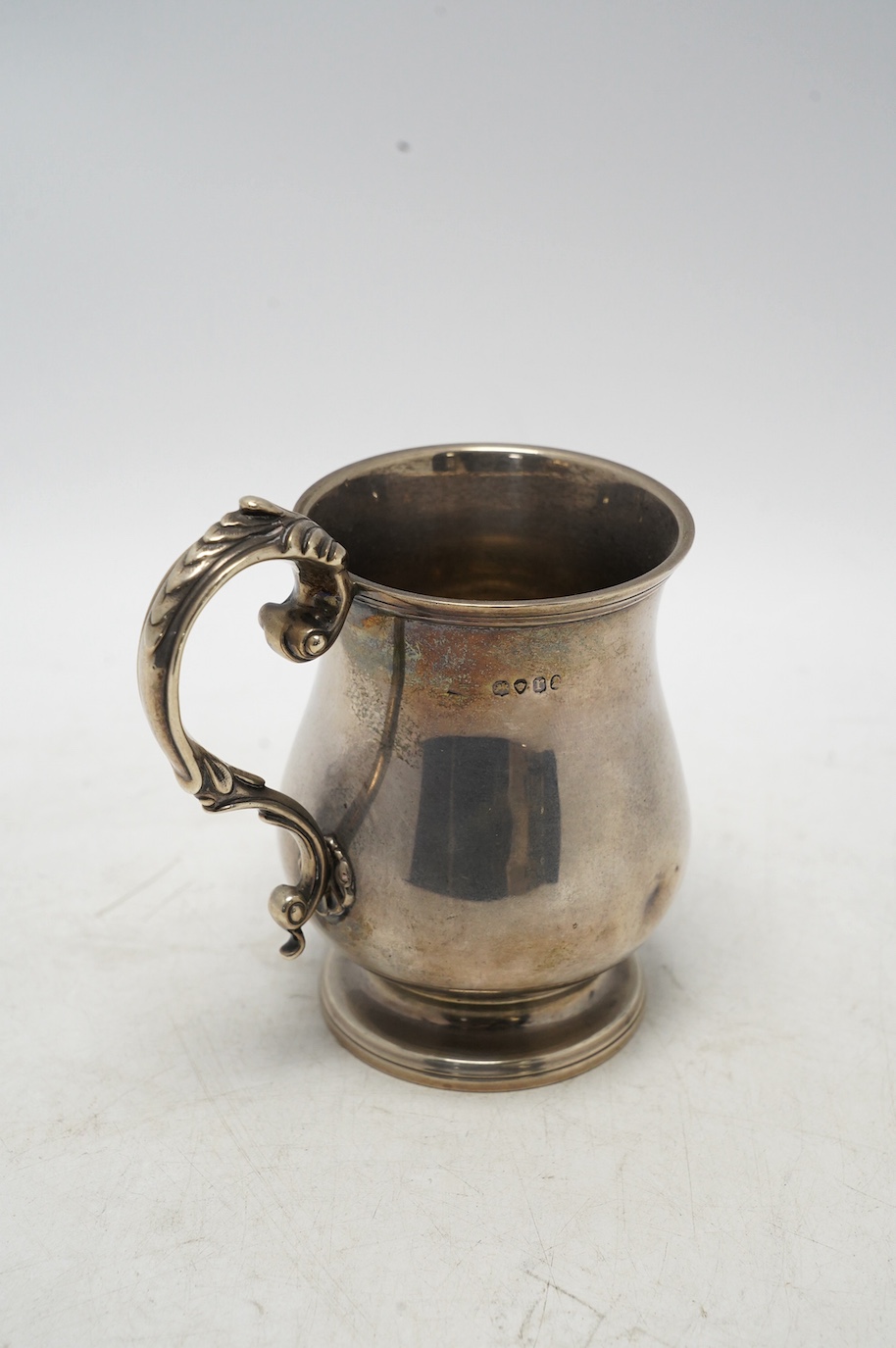 A William IV silver baluster christening mug, maker's mark rubbed, London, 1832, 11.8cm, 7.5oz, with later engraved inscription. Condition - poor